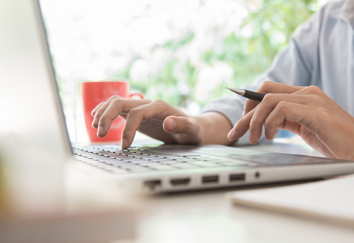 Image of someone using a laptop